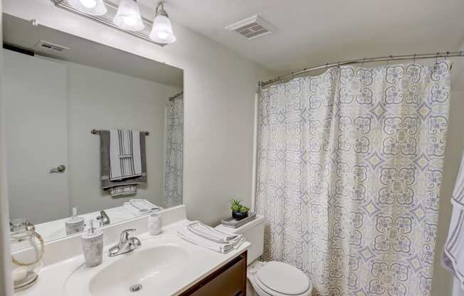 Bathroom with Vanity, Toilet & Shower with a curtain at Glen at Mesa Apartments, Mesa