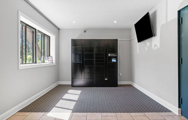 a room with a black front door and a window