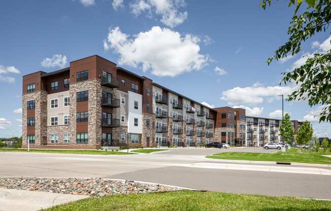 a large apartment building on the corner of a street