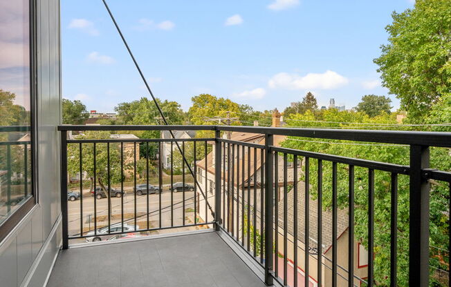 the view from the balcony of a home with a balcony guard rail