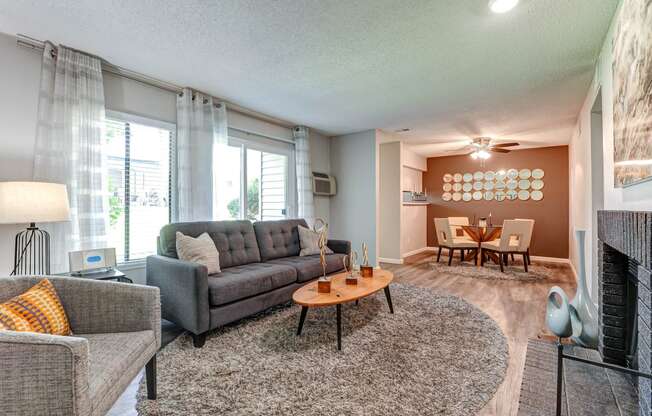 Liiving room with a couch and a table  at Union Heights Apartments, Colorado Springs, CO