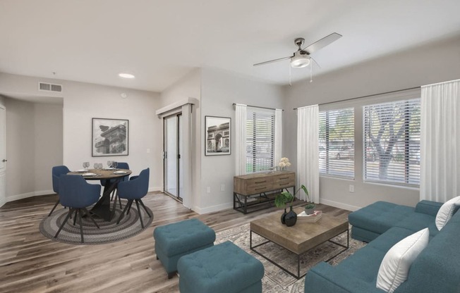 a living room with a couch and a table with chairs