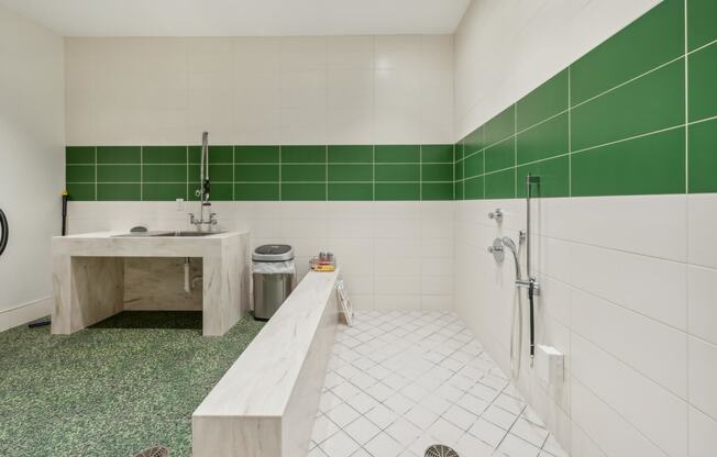 a white and green bathroom with a tub and a sink at The Merc, Waltham