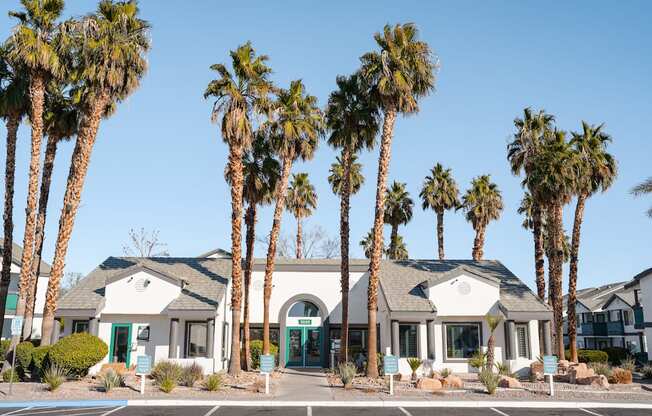 a building with palm trees in front of it