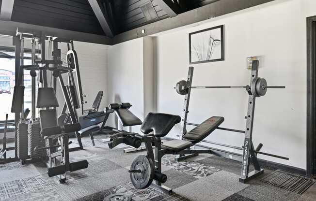 An on site fitness room with exercise equipment and treadmills at Aspen Ridge Apartments in West Chicago Illinois 60185