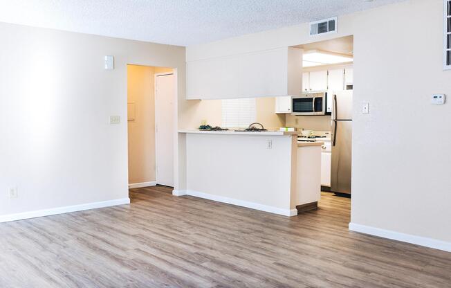 a kitchen with a wood floor