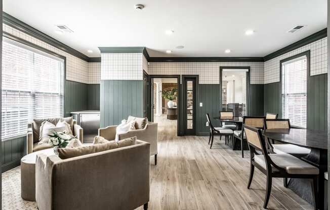 a living room with couches and chairs and a dining room table