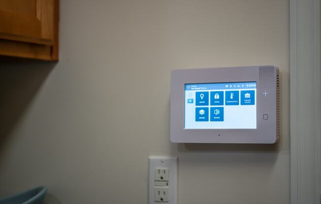 a computer monitor on a wall