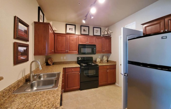 Kitchen Bar With Granite Counter Top at The Paramount by Picerne, Las Vegas, Nevada