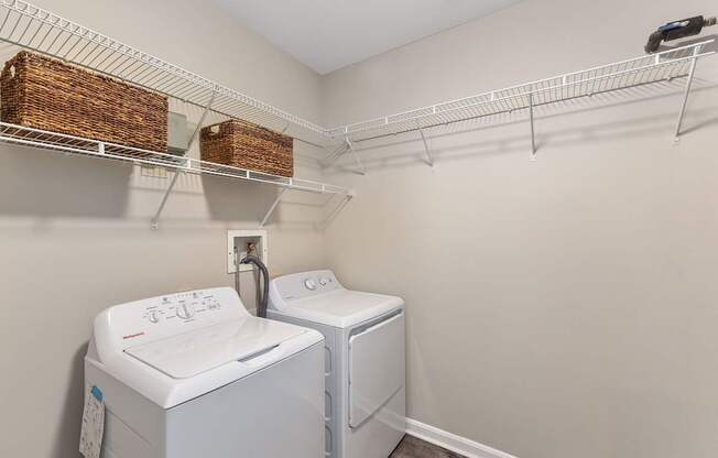 A laundry room with a washer and dryer.