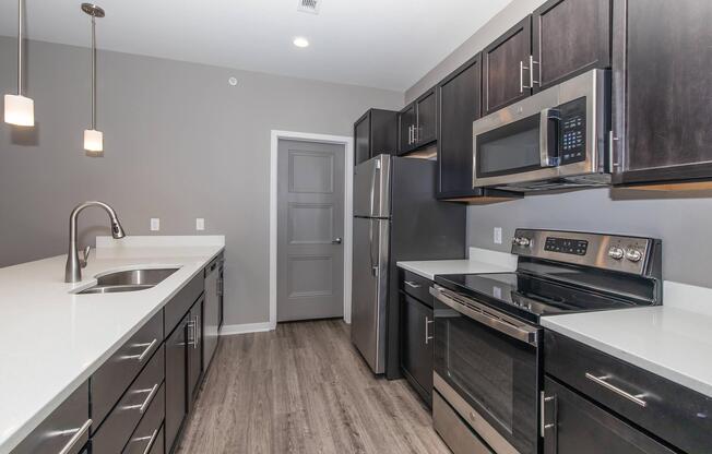 a large kitchen with stainless steel appliances