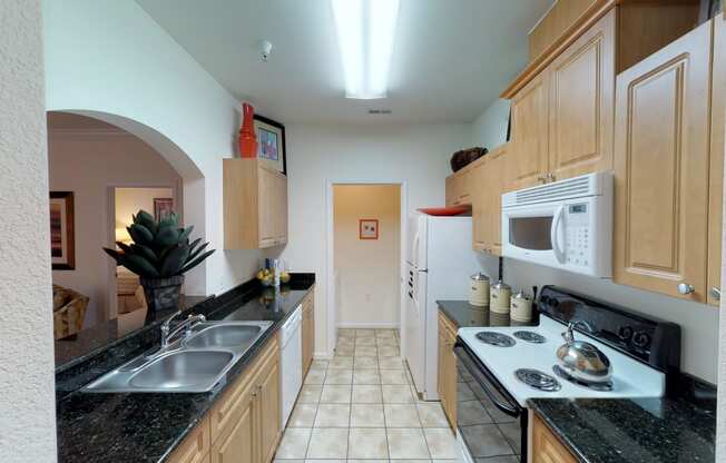 Kitchen with laundry room; open to living room