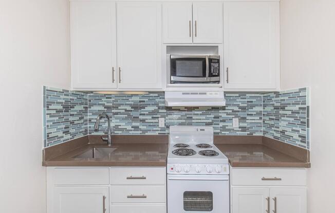 Kitchen with stainless steel microwave