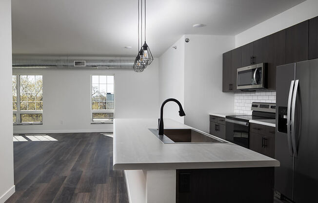 Kitchen with appliances at The Landing at 1001 NP, Fargo, ND 58102