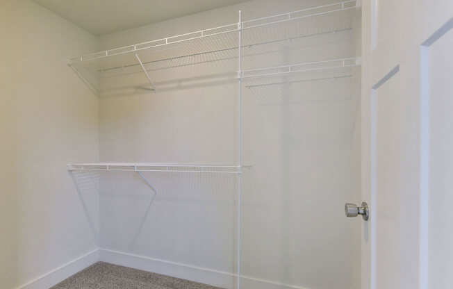 a large white walk-in closet with organzersat Copper Creek Apartment Homes, Maize, 67101