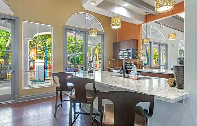 A kitchen with a counter and chairs. at Reserve at Canyon Creek,San Antonio, Texas