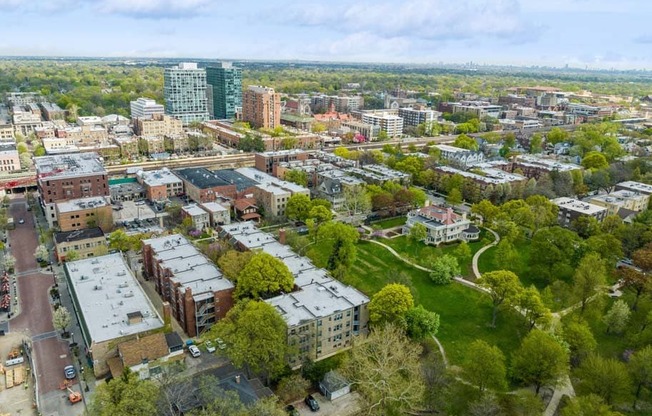 an aerial view of a city with buildings and trees at The Bryant at Oak Park I & II, Illinois