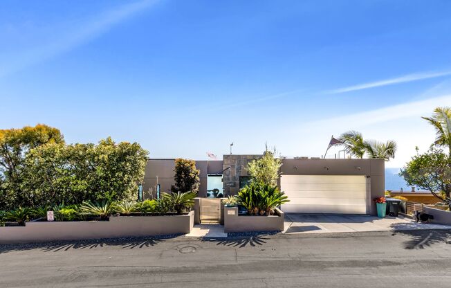 Contemporary Modern Masterpiece with Rooftop Deck and White Water Ocean Views in Laguna Beach