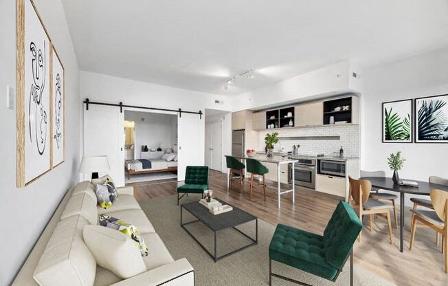 the living room and kitchen of a modern apartment