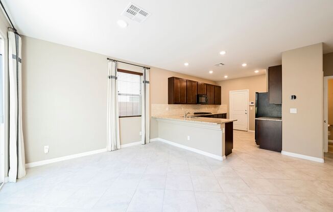Look No Further! Lovely 3 Bedroom And 2.5 Bathroom Is Located In The Beautiful Tule Springs Master Planned Community.
