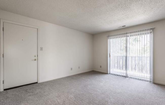 the preserve at ballantyne commons spacious living room with door to balcony