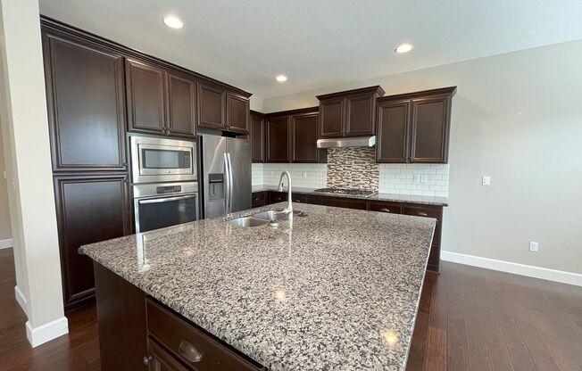 Spacious 4-Bedroom + Bonus Room with Modern Kitchen, Solar Panels & Private Fenced Backyard!
