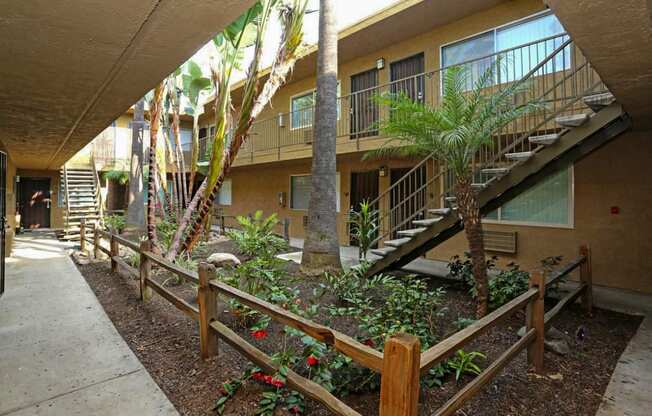 Garden style courtyard with lush matured landscaping in the center of apartment buildings