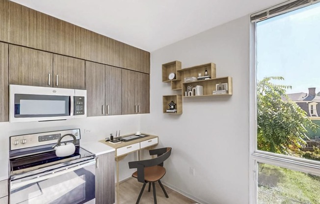 a kitchen with a stove and a microwave