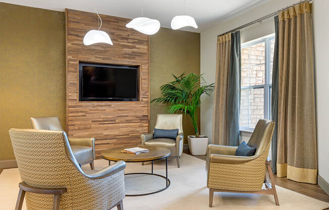 Seating area with TV on wall, at 1010 Dilworth Apartments, North Carolina, 28204