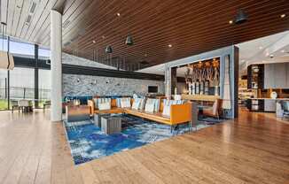 A modern interior with a wooden floor and a pool table.