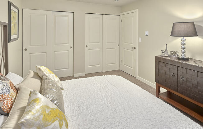 a bedroom with white closets and a white bedspread  at 3030 Lake City, Seattle, Washington