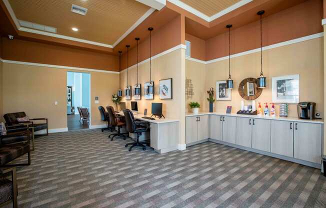 a large lobby with a desk and chairs and a counter