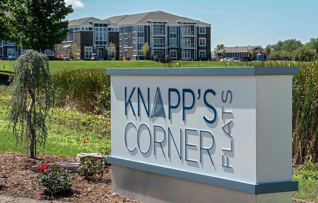 Knapp's Corner sign in front of a building.