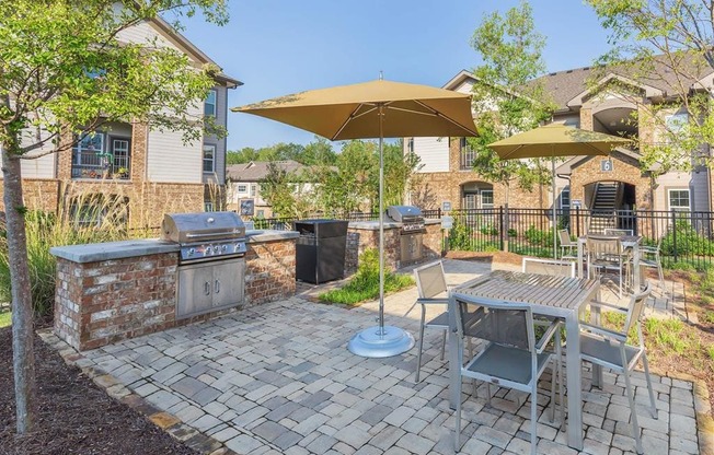 One White Oak Outdoor Living Area Including BBQs And Fire Pits in Cumming, Georgia Apartment Rentals