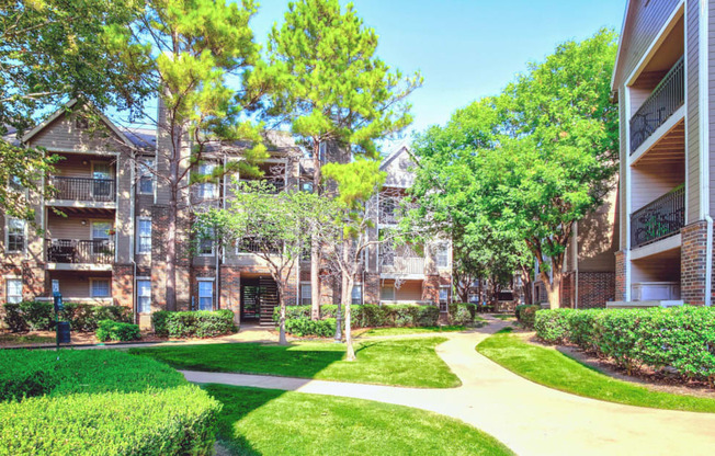 Mature trees and lush landscaping throughout the community at Riverside Park Apartments in Tulsa, OK!