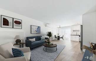 A living room with a grey couch, a coffee table, and a dining table.
