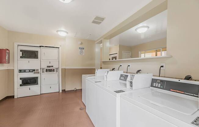 A laundry room with a washer and dryer.