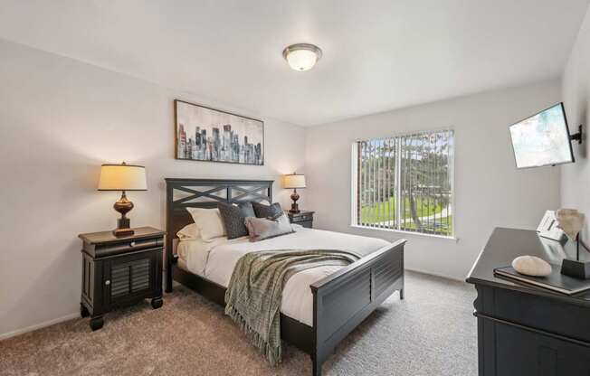 Cozy bedroom with ample storage space at Drawbridge Apartments in Harrison Township, MI.