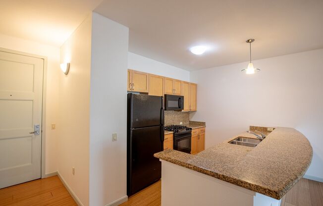 Sweet + secure 1/1 condo with parking, extra storage room + AC available now!