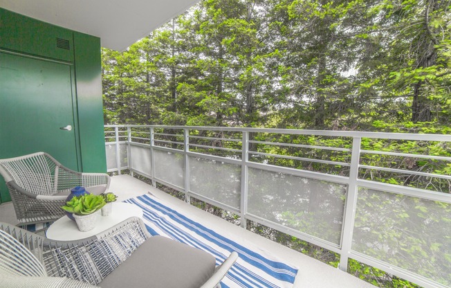 Enjoy a *private balcony experience with green views at the Arroyo Residences