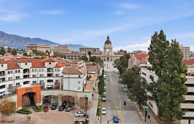 A city street with cars and buildings.