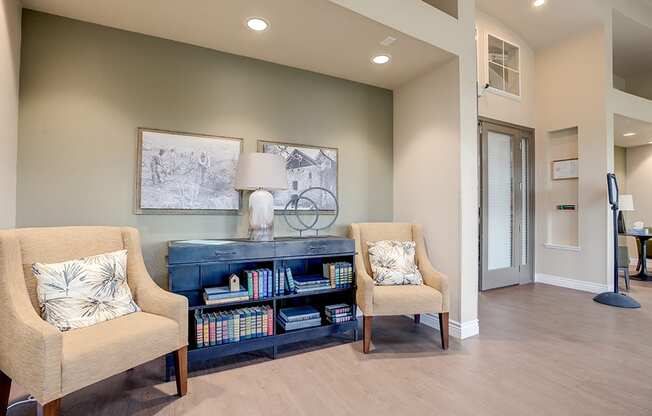 Seating area by bookcase at VINTAGE AT BENNETT VALLEY, Santa Rosa, CA 