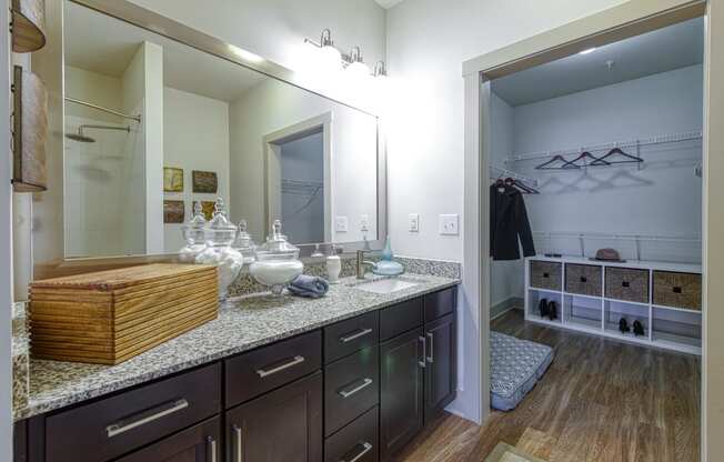 En-suite Bathrooms with Granite Countertops at 4700 Colonnade Apartments in Birmingham, AL