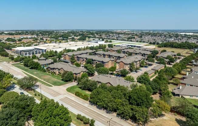 an aerial view of a suburban neighborhood with houses and trees