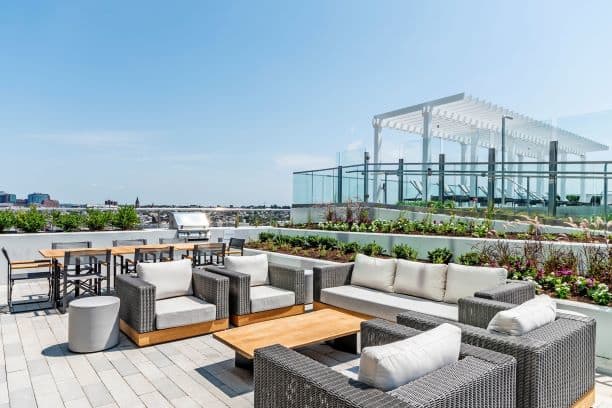 a roof top patio with chairs and tables