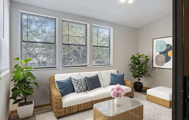 A living room with a three windows