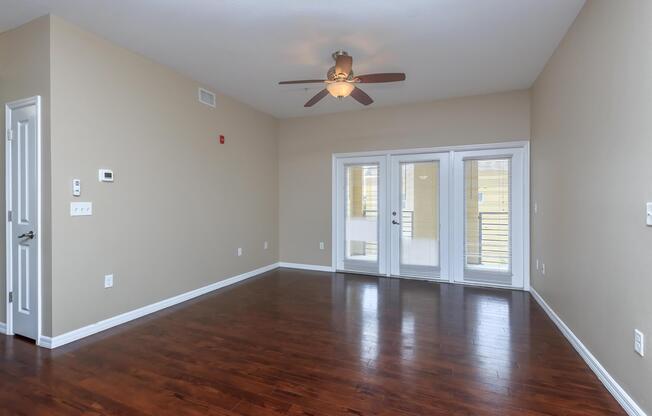 a large empty room with a wood floor