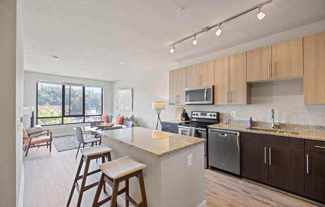 a kitchen and living room in a 555 waverly unit