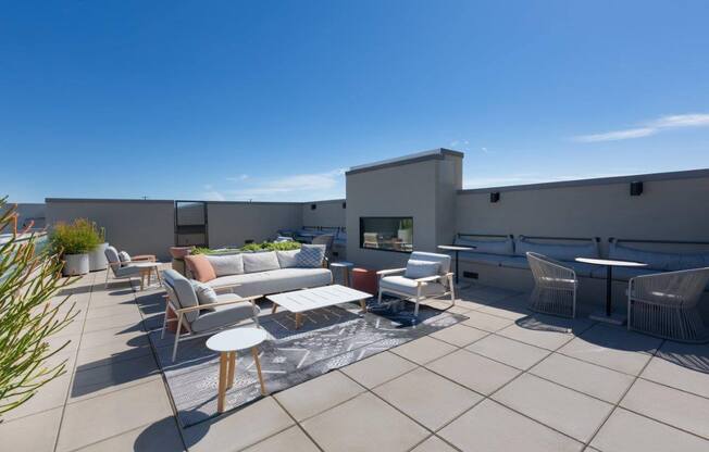 Rooftop lounge with tables and lounge chairs