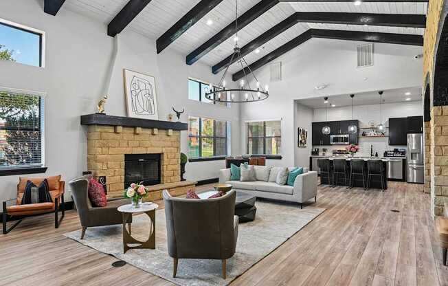 A modern living room with a fireplace and a dining area.